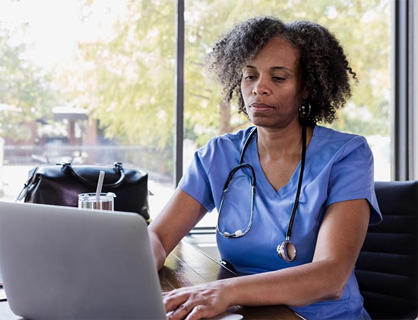 African doctor on computer