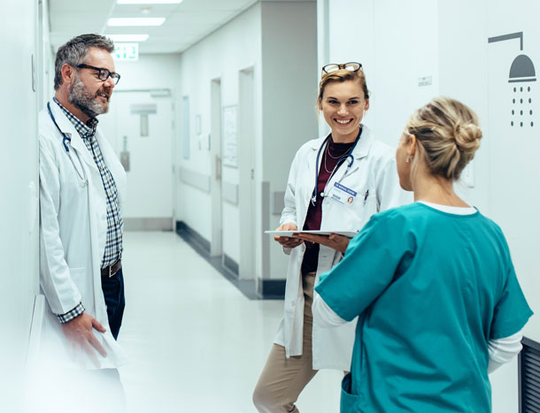 Surgeons and doctors in hallway