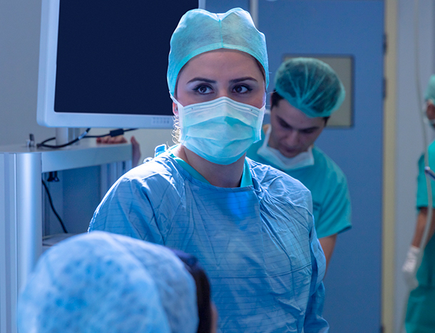 Young female surgeon in scrubs